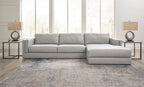 Sectional sofa with chaise lounge, light gray upholstery, squared arms and multiple seat cushions