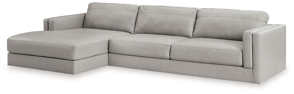 Sectional sofa with chaise lounge, light gray upholstery, tufted seat and back cushions