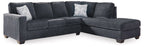 Dark gray sectional sofa with chaise, square arms and multiple back pillows