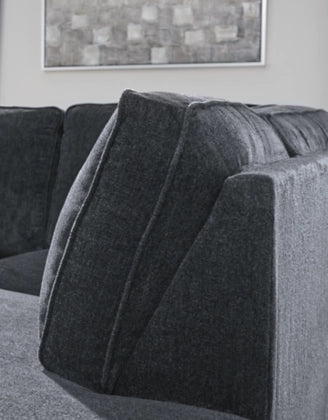 Dark slate sectional sofa backrest and armrest with textured fabric
