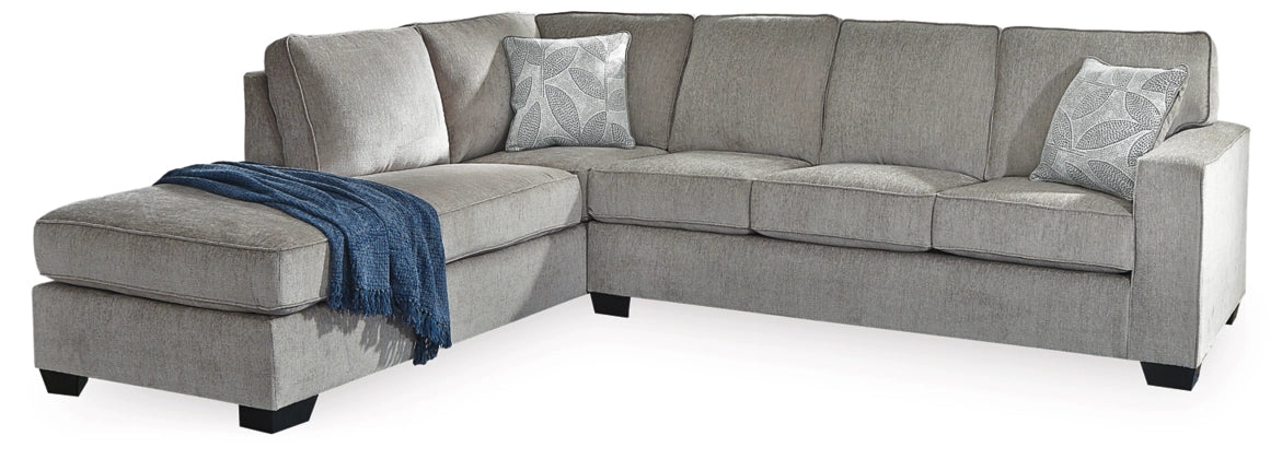 Light gray fabric sectional sofa with chaise and two accent pillows