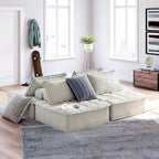 Taupe modular sectional chaise with pillows and textured upholstery on short legs