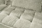 Close-up of taupe sectional seat cushions with textured fabric and stitched edges