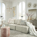 Light taupe modular sectional sofa with chaise, layered cushions, and textured upholstery