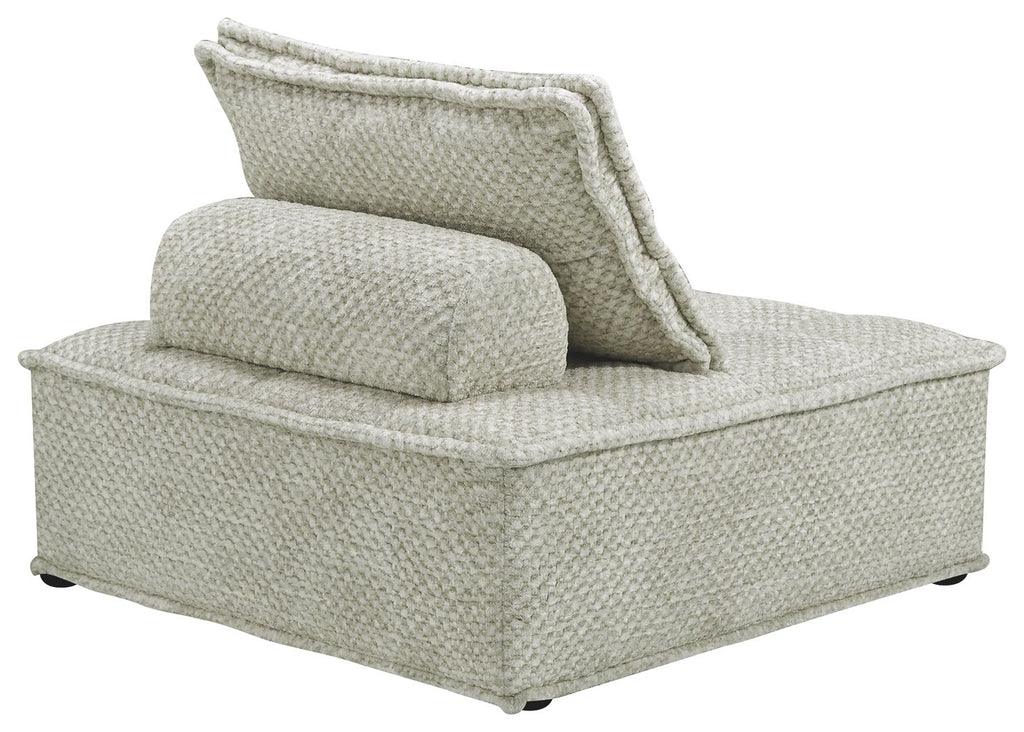 Taupe upholstered chaise lounge with wide armrest and textured fabric, side view