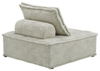 Taupe upholstered chaise lounge with wide armrest and textured fabric, side view