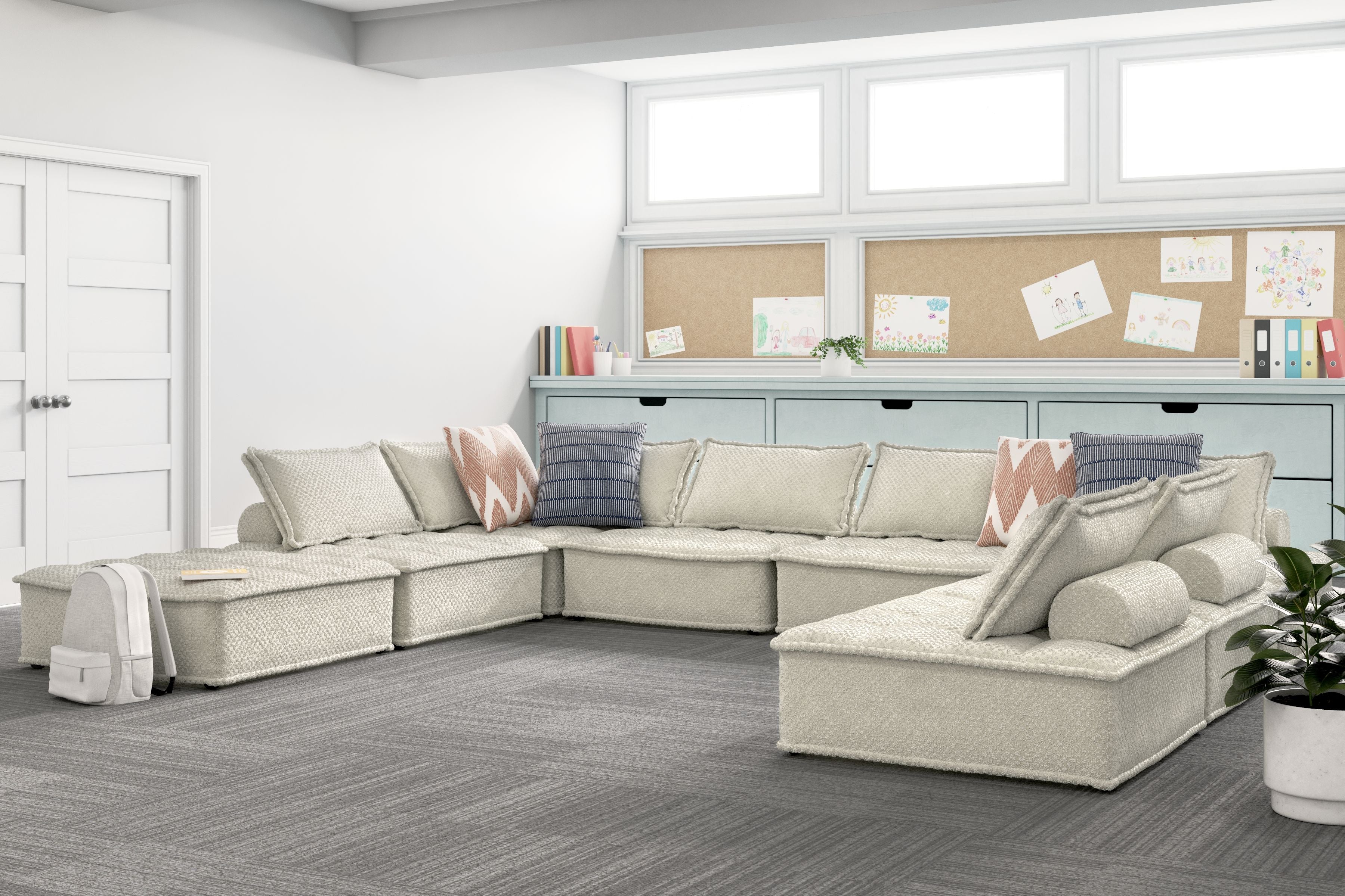 Taupe modular sectional sofa with chaise extensions and multiple back and accent pillows