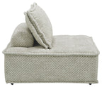 Taupe accent chaise with textured upholstery and tall back pillow, side profile