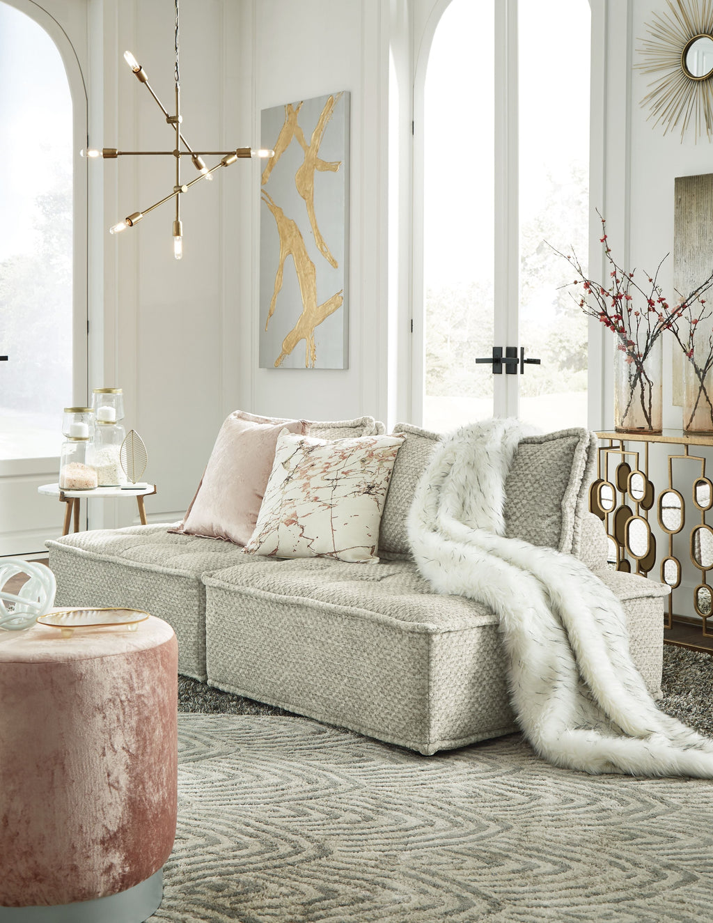 Taupe modular sectional sofa with wide chaise and layered accent pillows