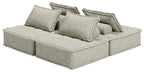 Taupe modular sectional sofa with three back cushions and extended chaise seat