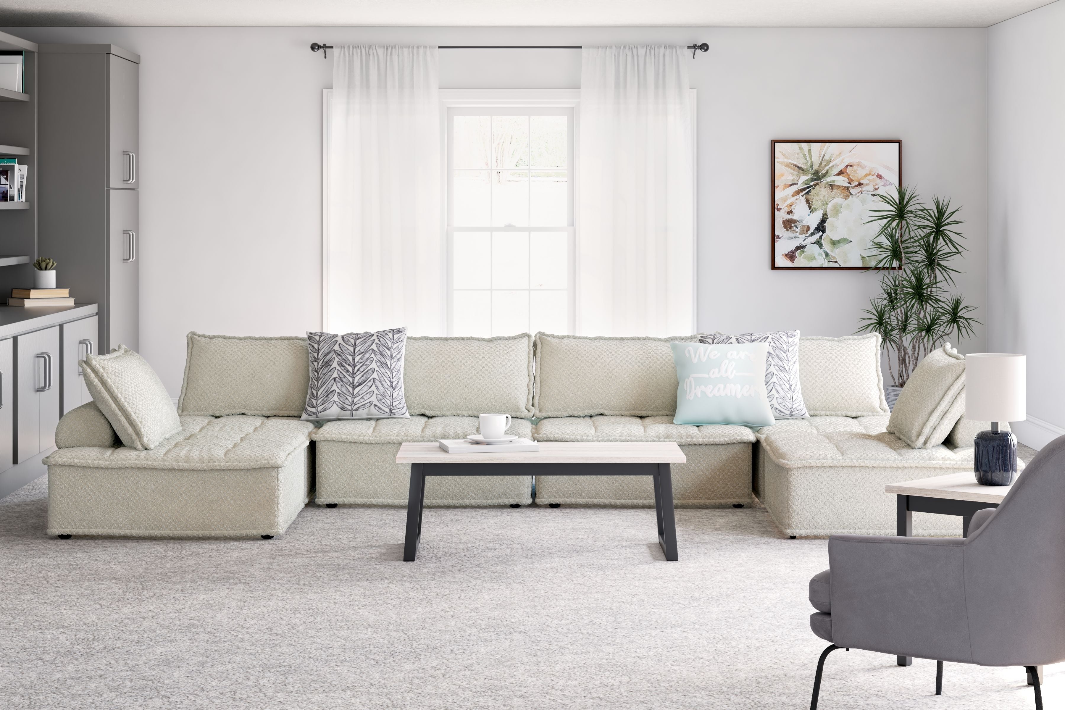 Taupe modular sectional sofa with long chaise and square throw pillows
