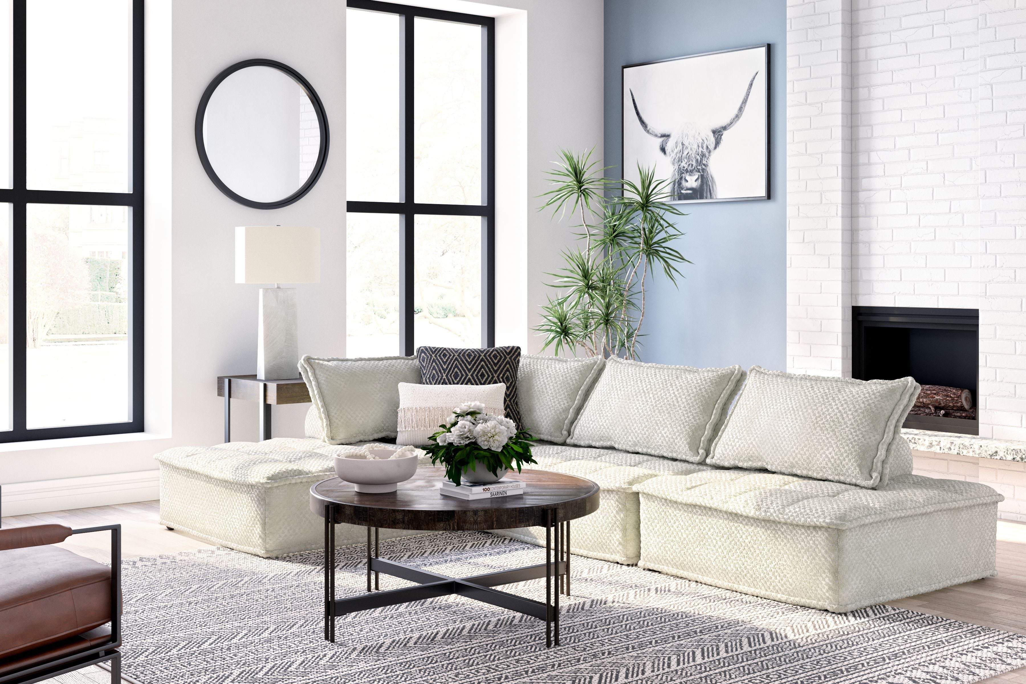 Taupe modular sectional sofa with chaise seat and multiple textured back pillows