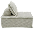 Taupe upholstered sectional chaise with side bolster and textured accent pillow