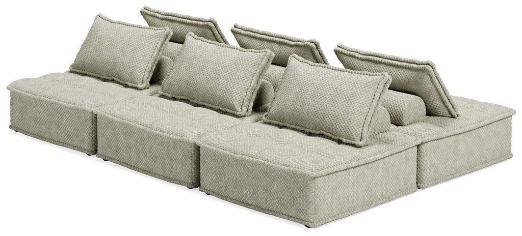 Taupe modular sectional sofa with several back cushions and extended chaise seat