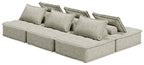 Taupe modular sectional sofa with several back cushions and extended chaise seat