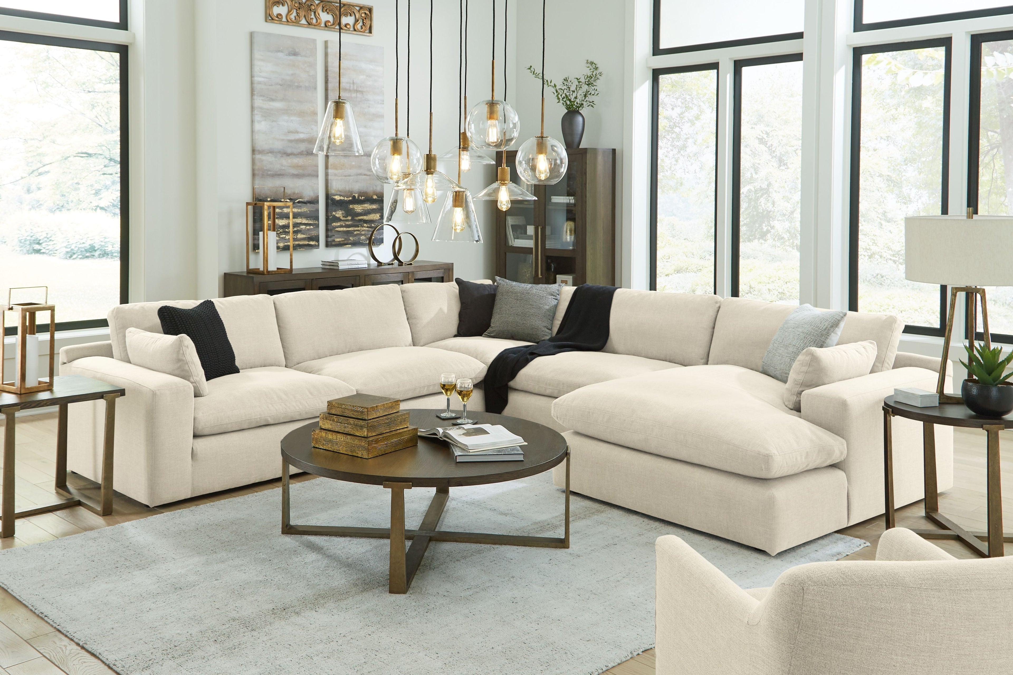 Beige linen sectional sofa with right chaise, decorative throw pillows and deep seat cushions