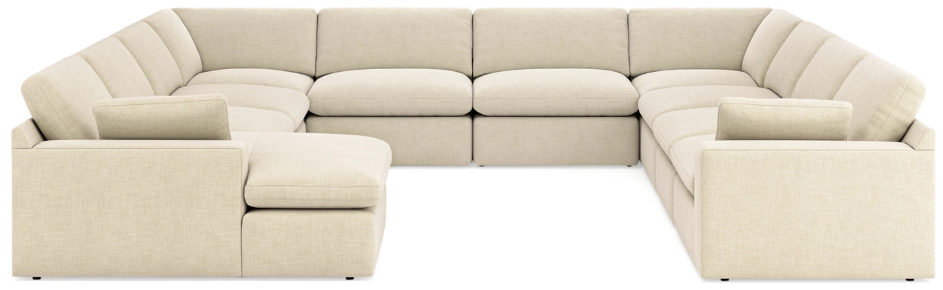 Linen sectional sofa with multiple chaise sections and light beige cushions