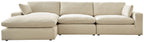 Beige linen sectional sofa with chaise extension, simple cushions and wide seat backs