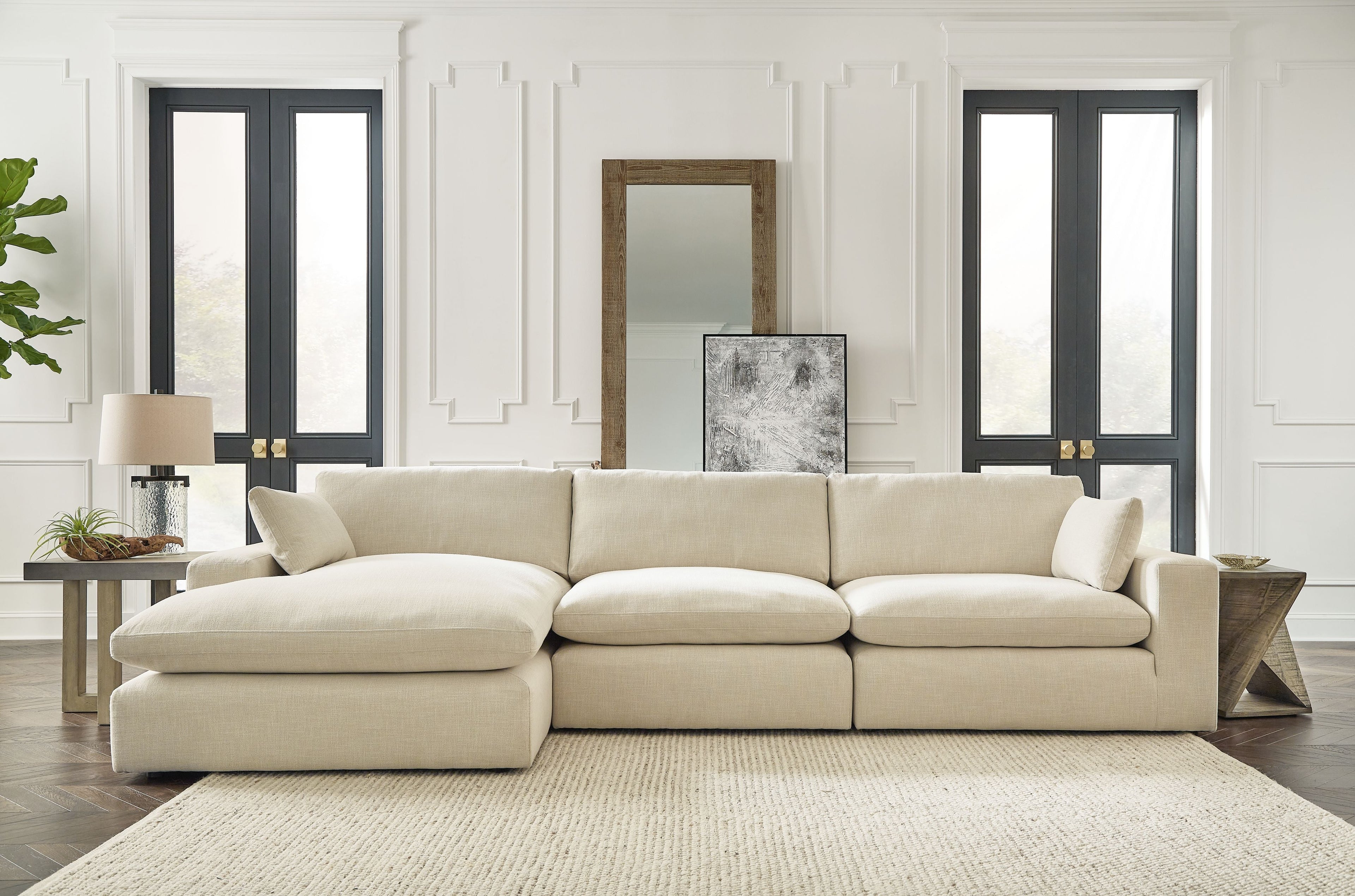 Beige linen sectional sofa with left chaise, low profile and clean-lined seat cushions