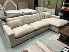 Beige linen sectional sofa with chaise, deep cushions and squared ottoman-style seats