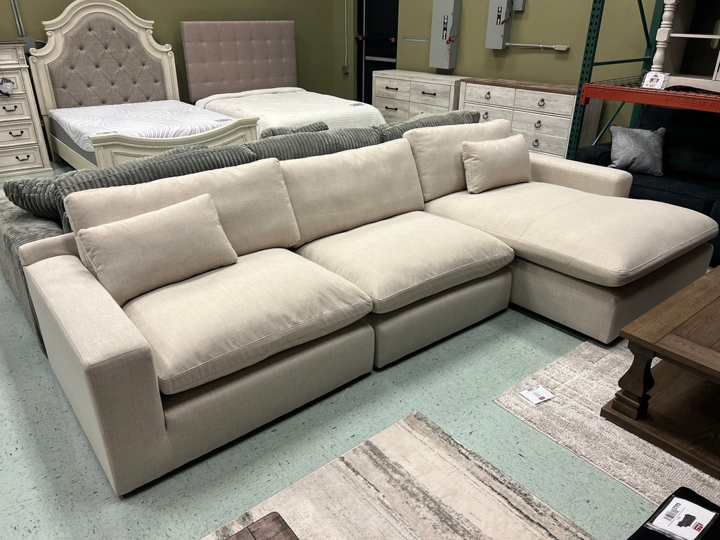 Beige linen sectional sofa with chaise, deep cushions and squared ottoman-style seats