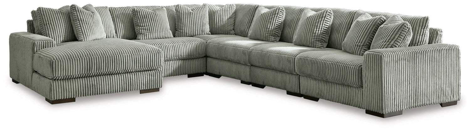 Fog sectional sofa with chaise ends, vertical channel tufting, and textured upholstery.