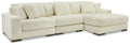 Ivory sectional sofa with chaise corner, ribbed corduroy-like upholstery, and boxy arms.