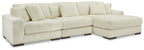 Ivory sectional sofa with chaise corner, ribbed corduroy-like upholstery, and boxy arms.