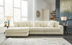 Ivory sectional sofa with chaise and multiple back cushions, ribbed textured upholstery.