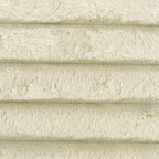 Ivory sectional upholstery fabric close-up with ribbed corduroy texture and soft pile.