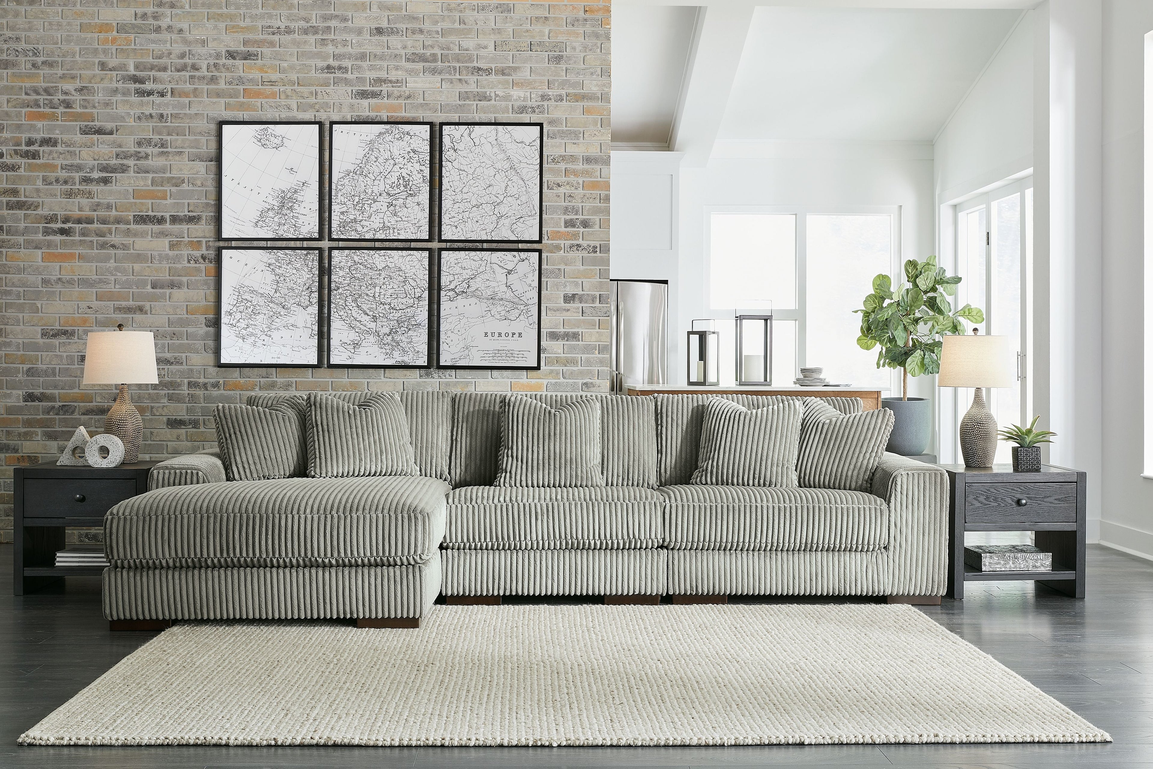 Sectional sofa with chaise, ribbed striped upholstery in light gray-green, rolled arms