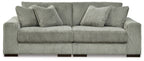 Sectional sofa with tufted back cushions, ribbed striped upholstery in light gray-green