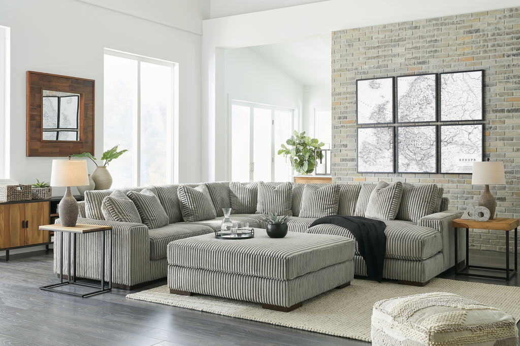 Sectional sofa with chaise, ribbed striped upholstery in light gray-green, ottoman