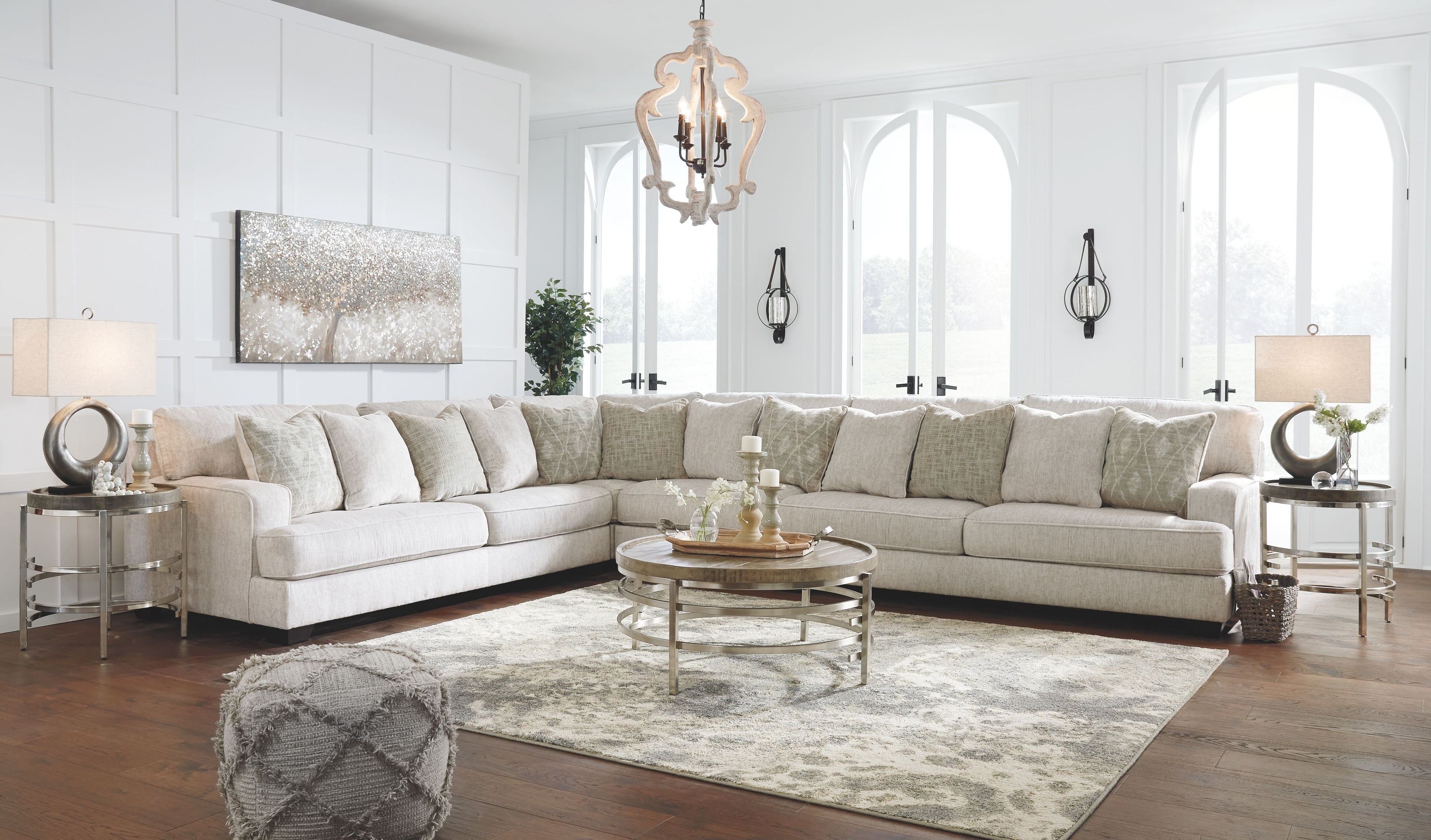 Light beige sectional sofa with tufted seat cushions and corner return