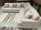 Light beige L-shaped sectional sofa with plush seat and corner chaise