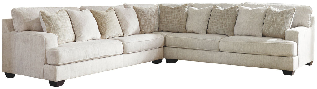 Beige sectional sofa with tufted back cushions and chaise-style corner