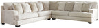 Beige sectional sofa with tufted back cushions and chaise-style corner
