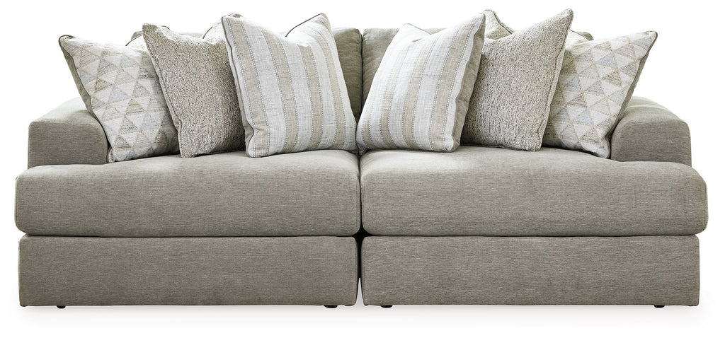 Gray sectional sofa with chaise and patterned striped accent pillows