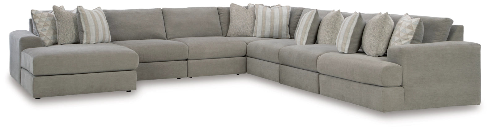 Light gray sectional sofa with chaise modules and neutral striped throw pillows.