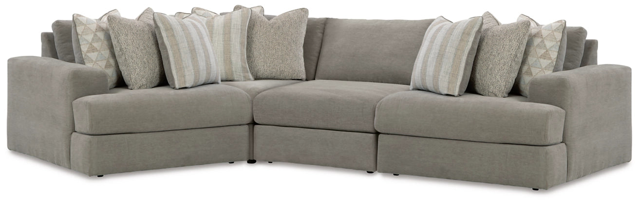 Ash-gray fabric sectional sofa with corner chaise and several accent pillows