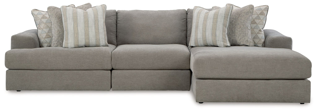 Gray sectional sofa with wide chaise and striped accent pillows