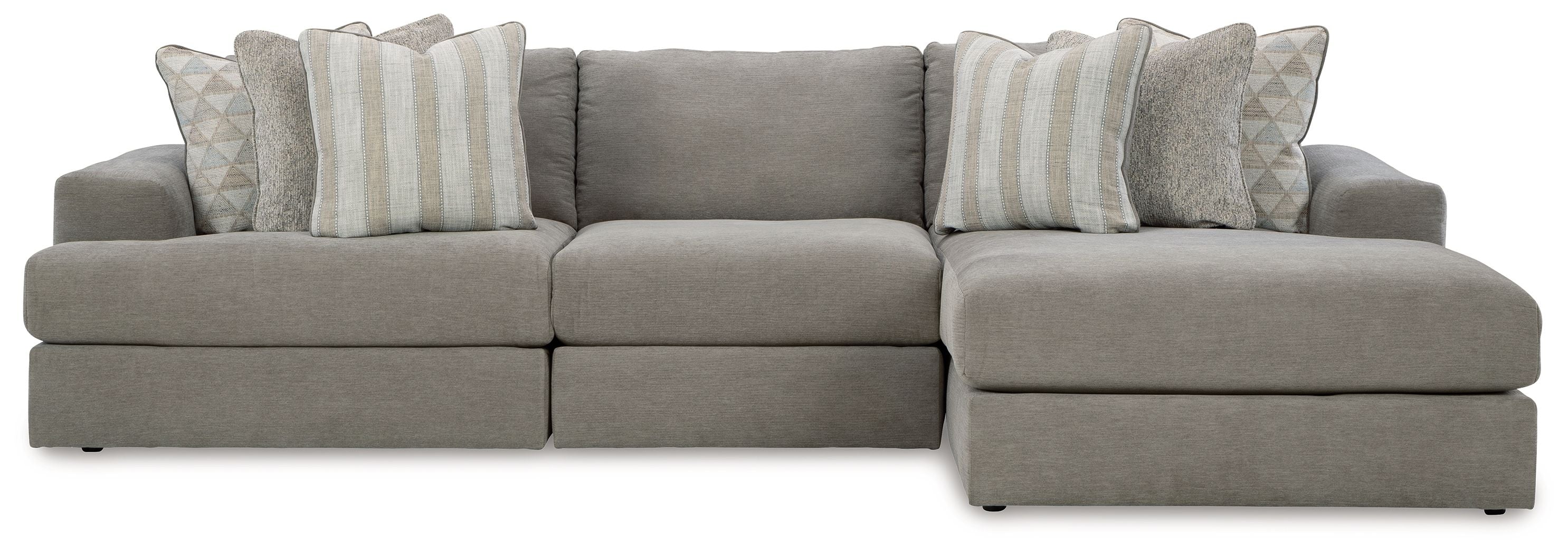 Gray sectional sofa with wide chaise and striped accent pillows
