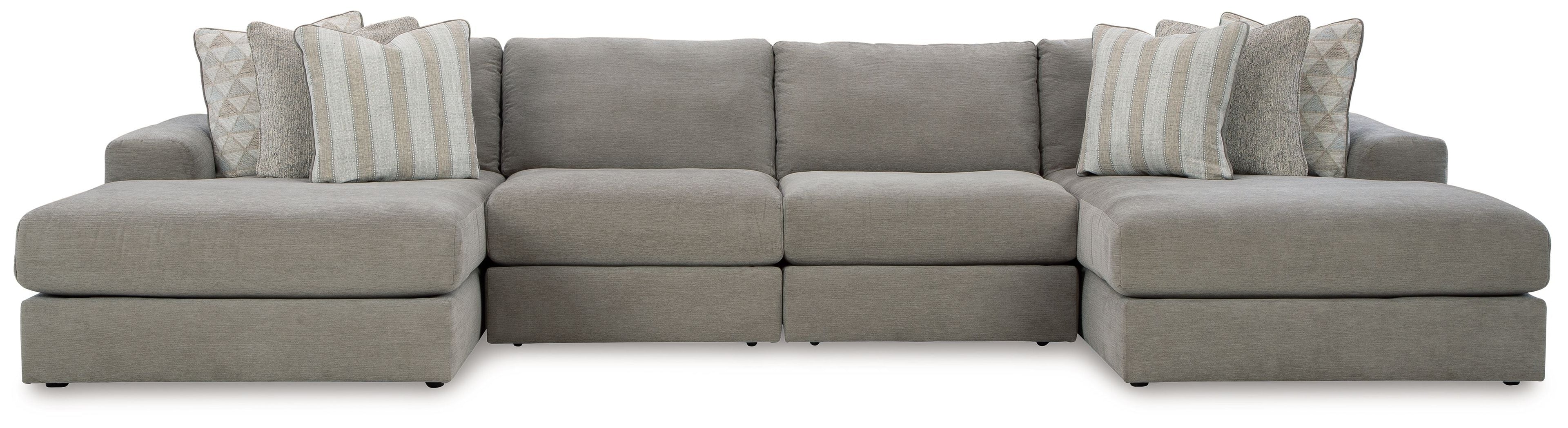 Gray sectional sofa with chaise and back pillows in striped and solid styles