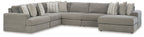 Gray corner sectional sofa with boxy arms and layered throw pillows