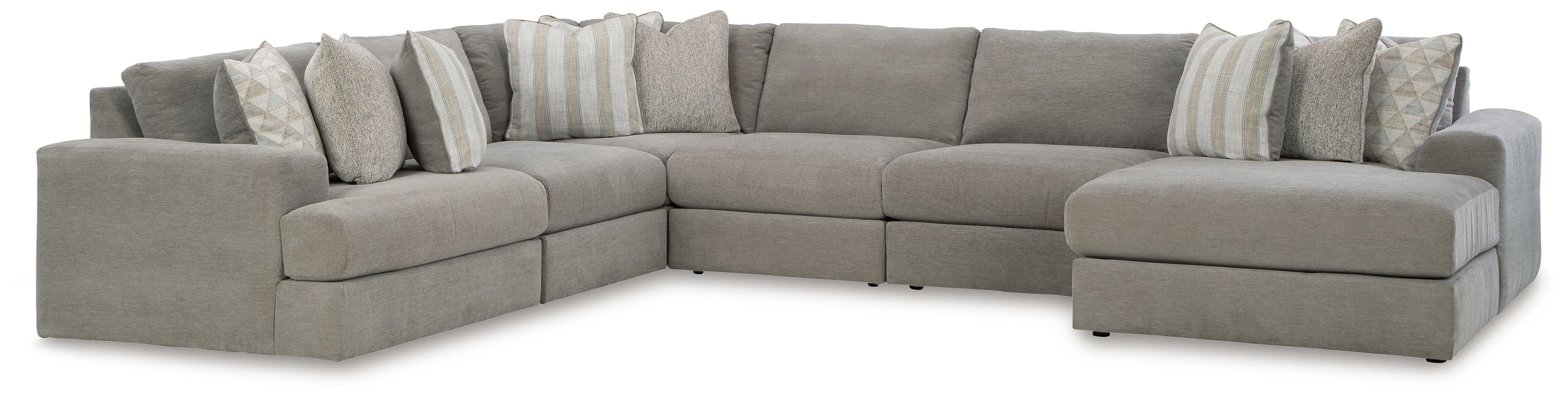 Gray corner sectional sofa with boxy arms and layered throw pillows