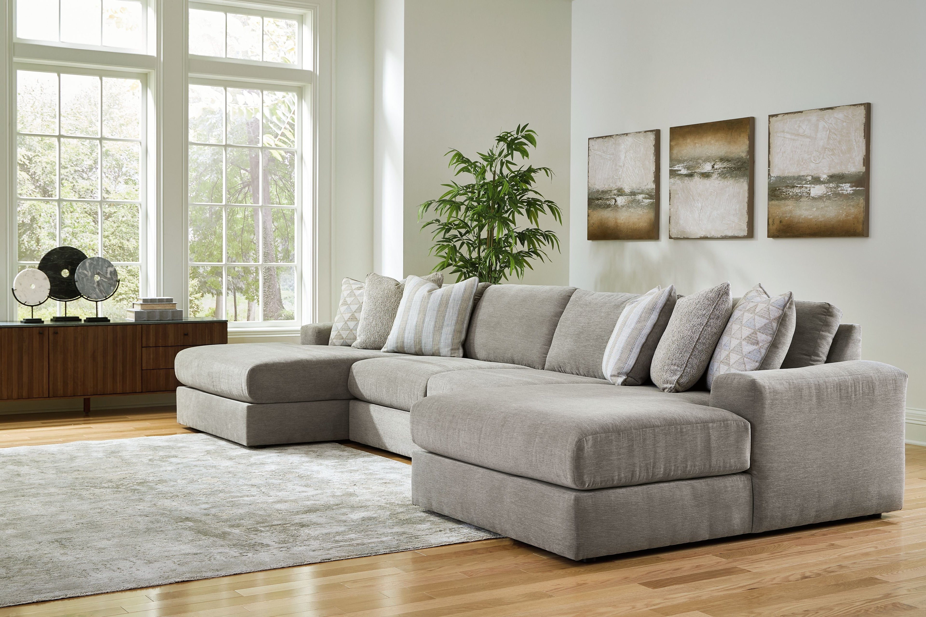 Gray sectional sofa with chaise, striped and solid throw pillows