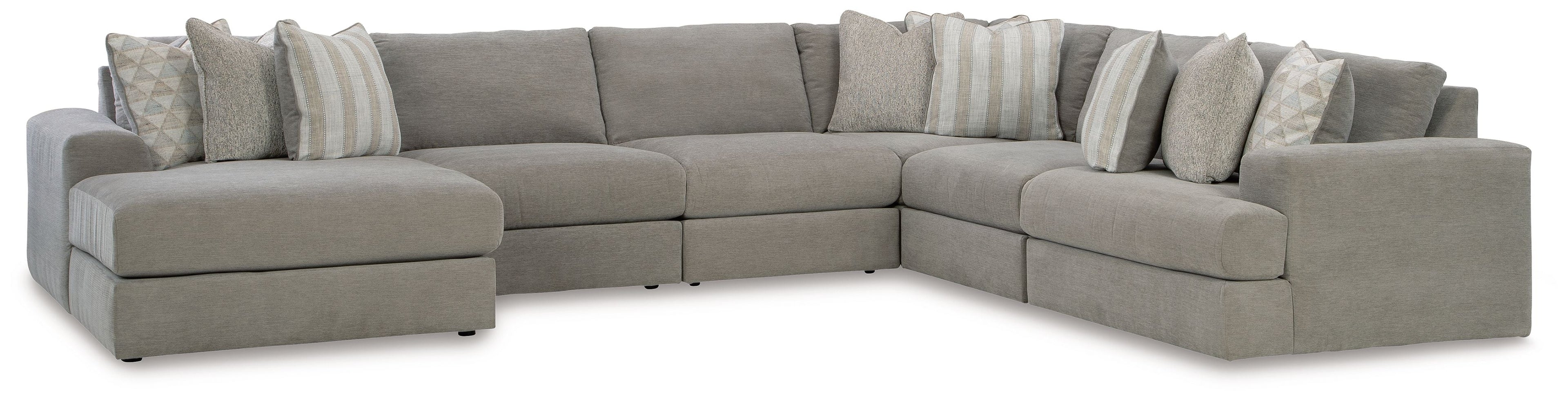 Gray sectional sofa with chaise, tufted seat cushions and striped throw pillows