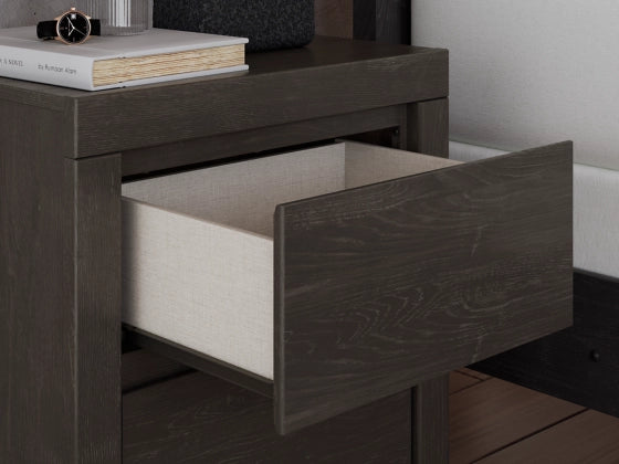 Dark gray nightstand with one drawer open showing light interior