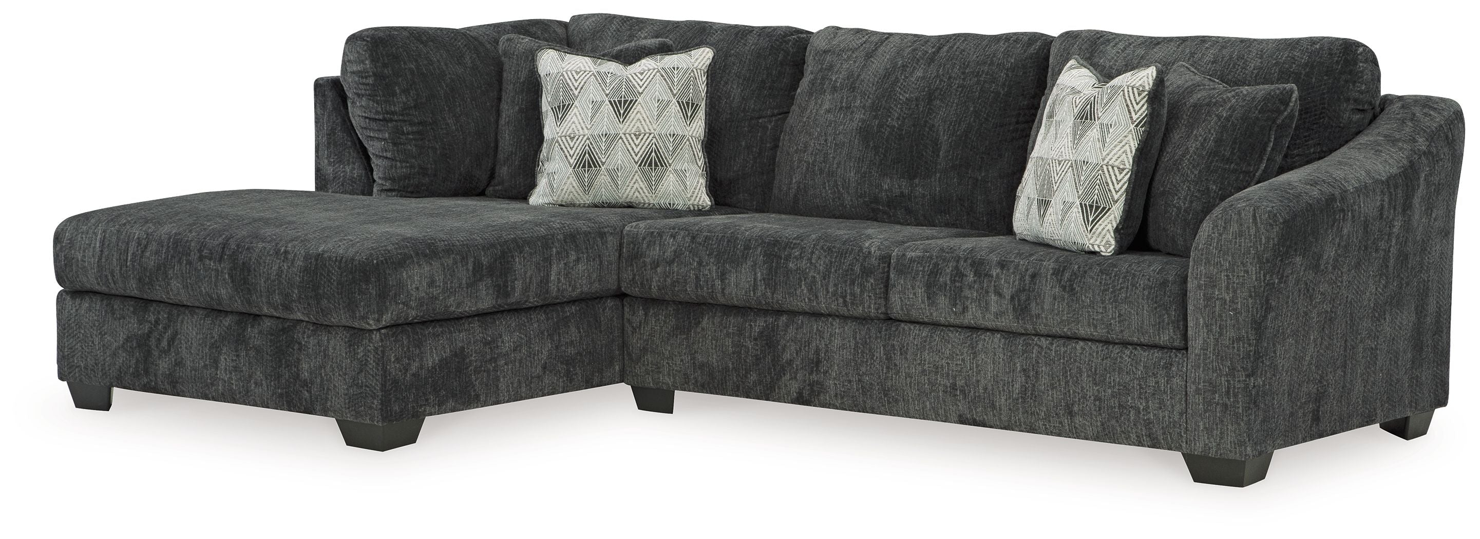 Dark charcoal sectional sofa with chaise, tufted cushions and patterned accent pillows