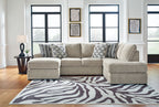 Light beige sectional sofa with corner chaise and patterned accent pillows